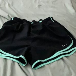 Medium black and teal Nike running shorts